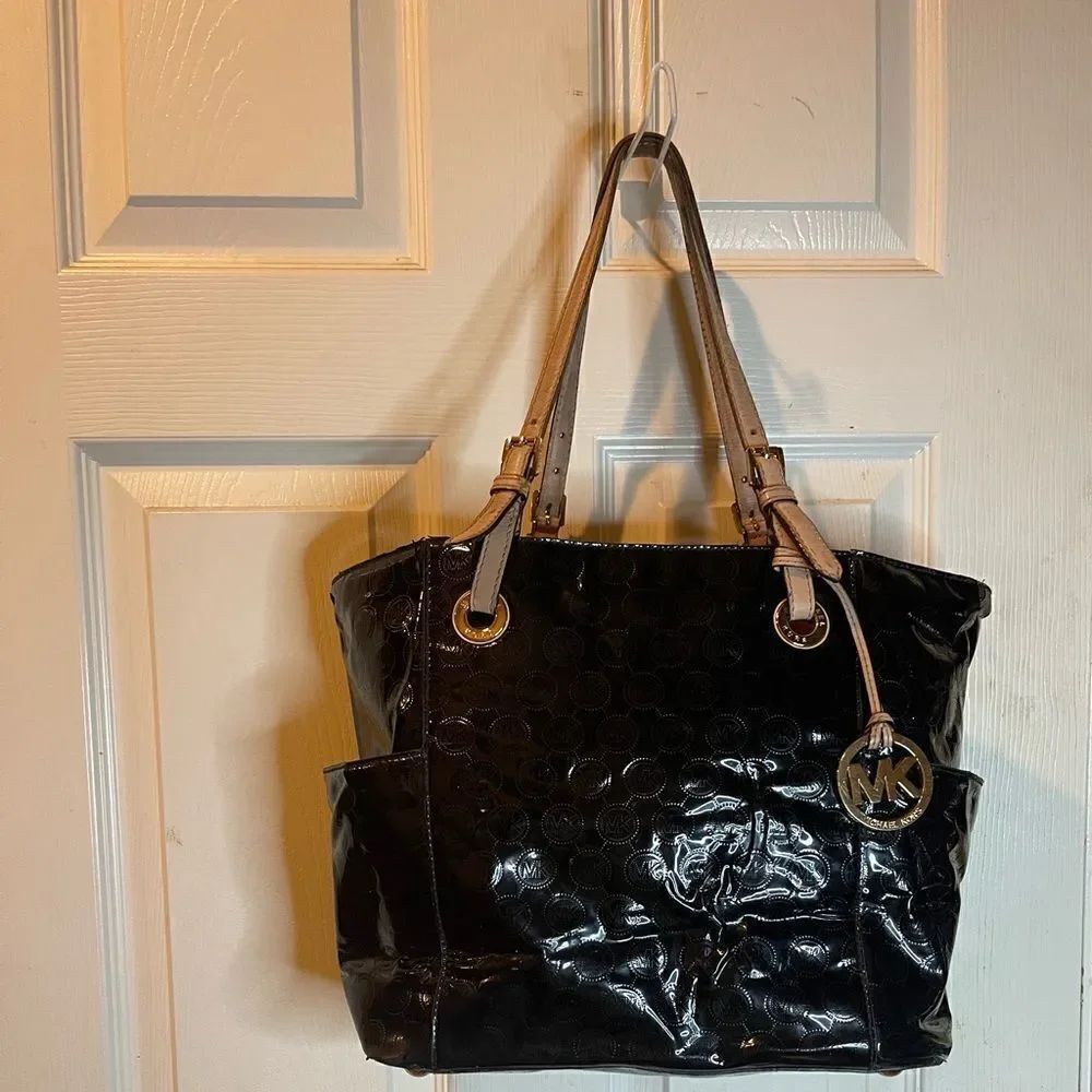 Michael Kors black patent logo shoulder bag with beige leather straps .